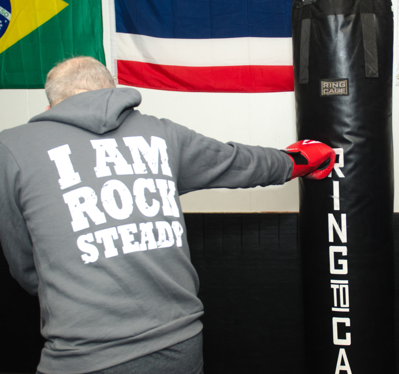 Rock Steady Boxing Seattle fighter Geof Miller on the heavy bag